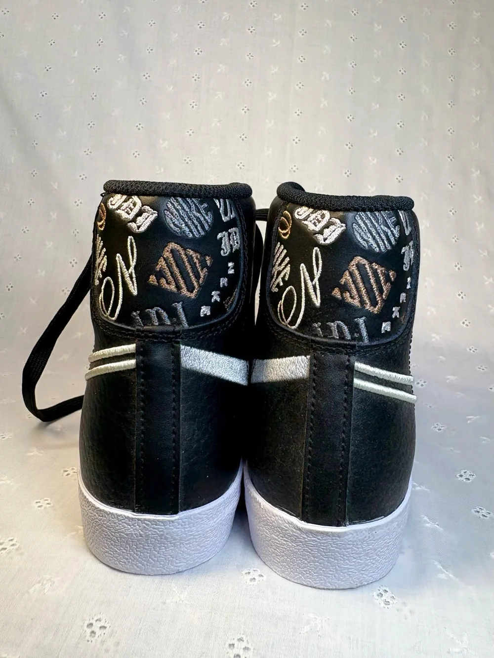 Nike Black High-Top Sneakers with White Tongue Text